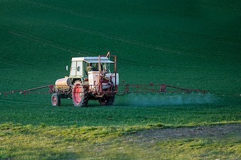 tractor spraying pesticide